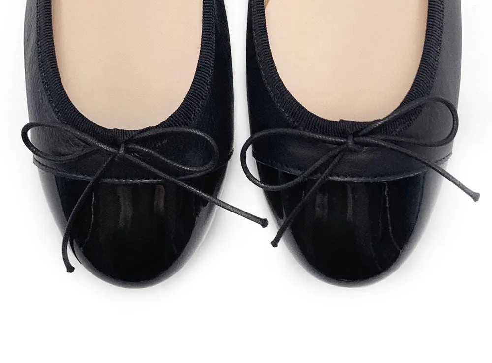 Black leather ballet flats with black patent toe