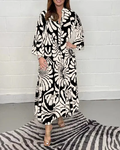 Bohemian-Inspired Flowing Maxi Dress with Bold Artistic Print