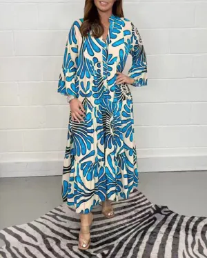 Bohemian-Inspired Flowing Maxi Dress with Bold Artistic Print